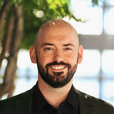 Chiropractor Mason Greenslade Smiling Outdoors