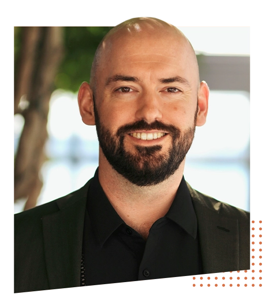Chiropractor Mason Greenslade Smiling Outdoors Overlaid Onto Shape